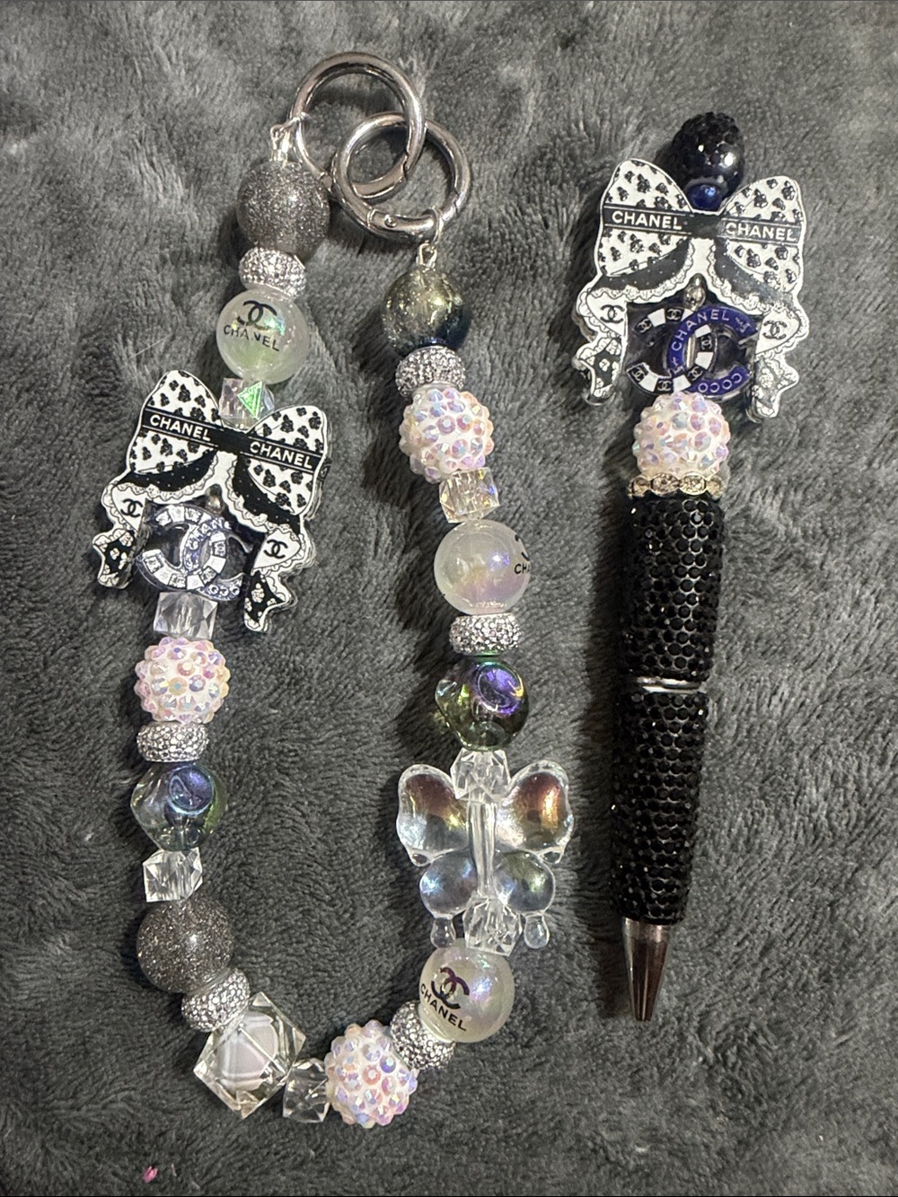 Black and White Beaded Bag Charm with Bow Accent and Matching Rhinestone Pen.